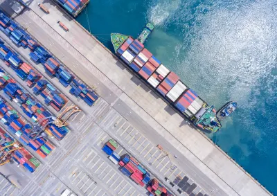 Aerial view of a container ship unloading at a port