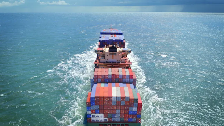 Rear view of a cargo ship in transit